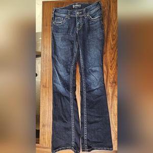 Silver Suki Surplus  27/34. Stretch Jeans. Boot Cut.